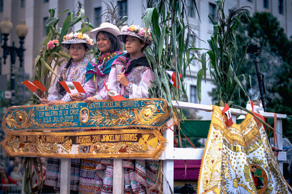 Three girls in colorful traditional festival attire