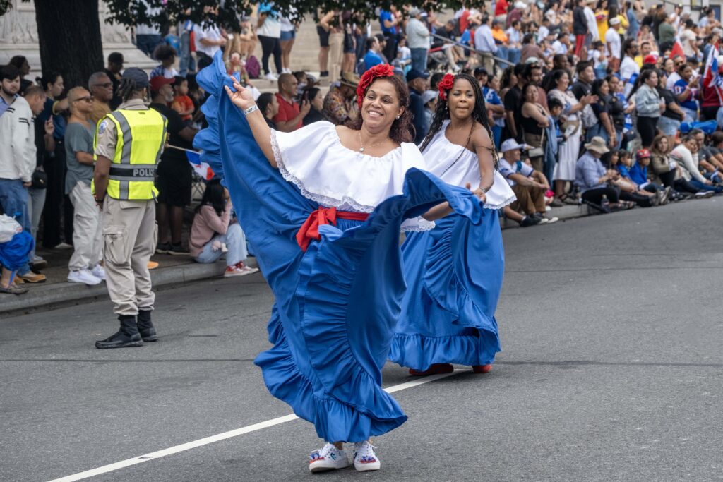 Dancers in blue traditional dresses at parade