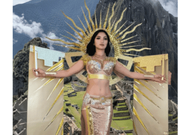 Peruvian woman in golden costume at Machu Picchu